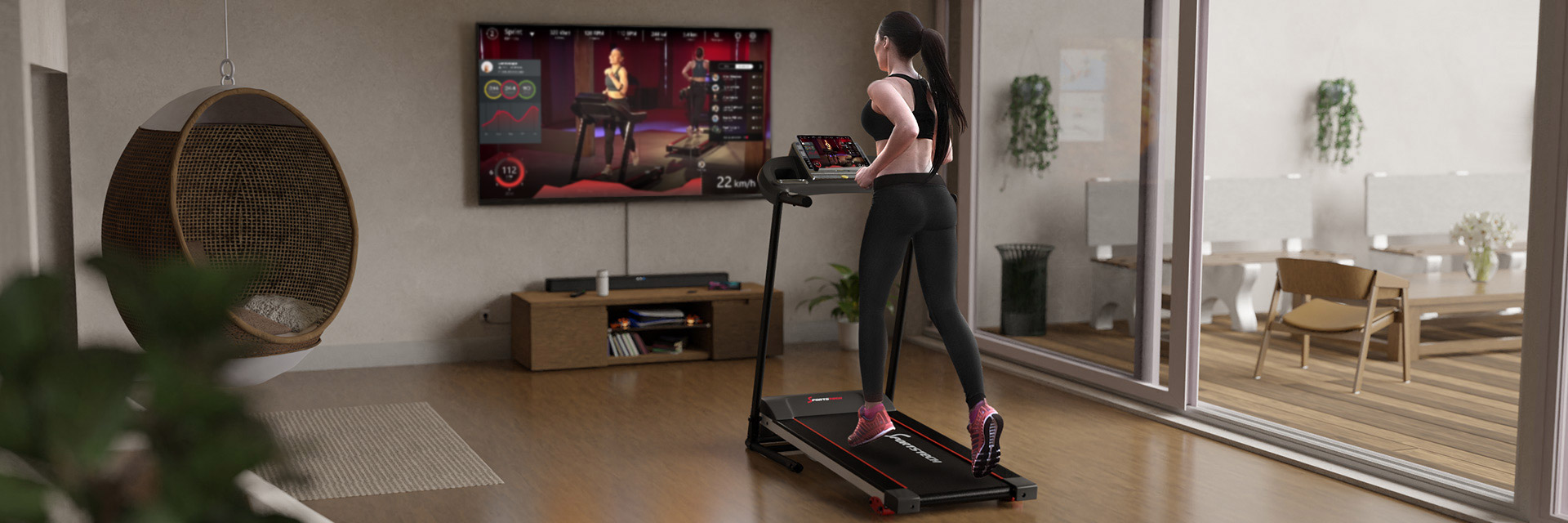 Frau in Sportkleidung läuft auf schwarzem Laufband F10, TV im Hintergrund